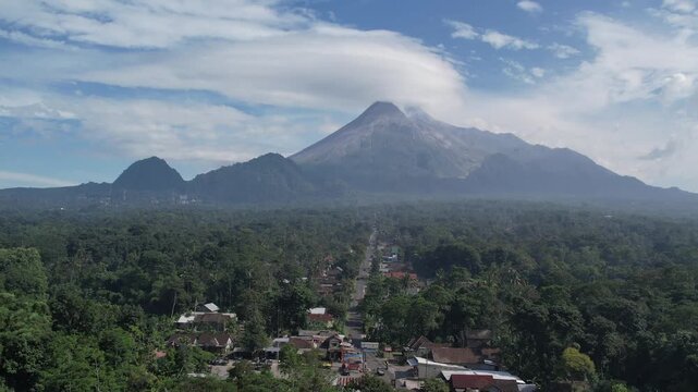 Majestic Merapi Volcano Peaks with Early Morning Clouds