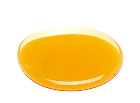 Honey spill isolated on white, side view