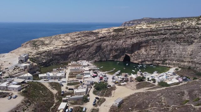 Dwejra Inland sea and cliffs on a sunny summer day. Aerial view Gozo island, Malta. High quality 4k footage