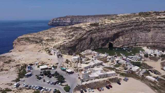 Dwejra Inland sea and cliffs on a sunny summer day. Aerial view Gozo island, Malta. High quality 4k footage