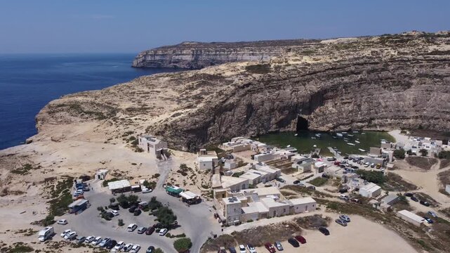 Dwejra Inland sea and cliffs on a sunny summer day. Aerial view Gozo island, Malta. High quality 4k footage
