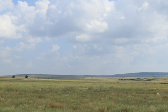 clouds over the steppe on a sunny summer day
