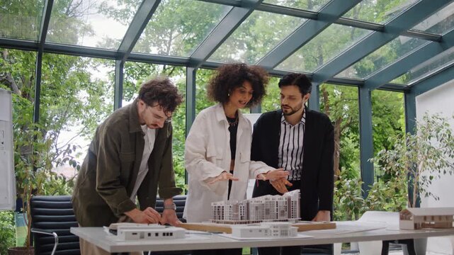 Architectural designers evaluate residential building models