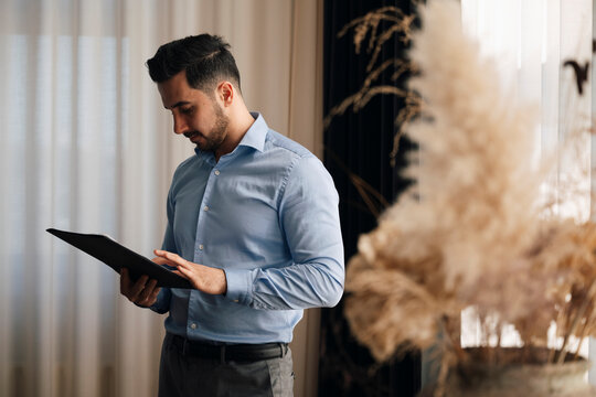 Businessman reviewing documents while working at office