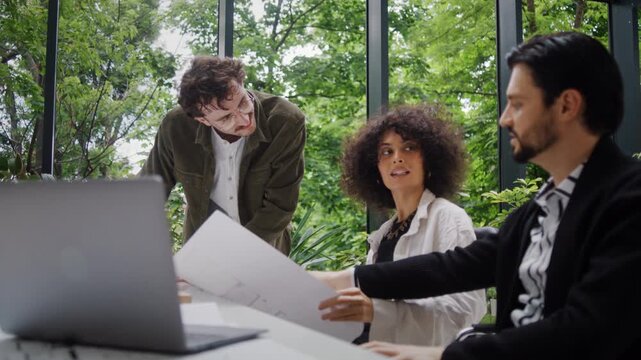Multinational team exchanges inspiring ideas about high-rise