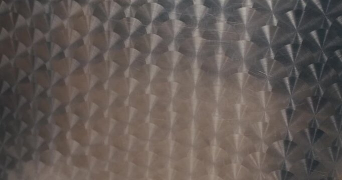 abstract metallic patterned shiny neutral silver background. embossed reflective smooth surface of metal iron table or wall. real realistic textured 3D background. Pattern mock up banner