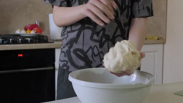 Crafting bread with skill. Hands working on fresh pastry dough. Artisan bread shaping with warm rustic charm. Creating homemade bread through careful kneading and traditional baking techniques