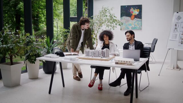 Architectural team confidently discusses construction stages