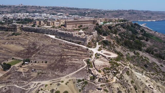 Fort Chambray, Gozo, Malta, aerial view. Approaching from the Xatt L-Ahmar salt pans. High quality 4k footage