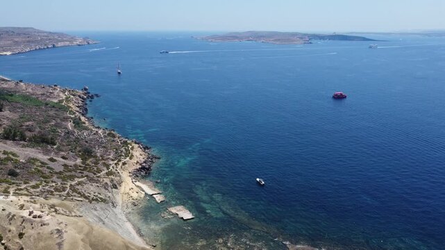 Aerial view of coastal landscape stationary aerial shot, in coastal area with islands and water bodies, with islands, water bodies, rocky coastline, with rock, sand, water texture.