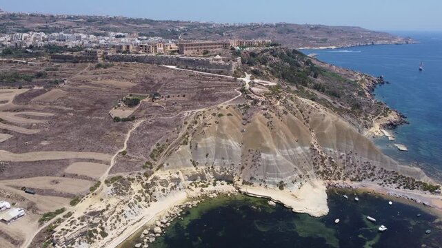 Fort Chambray, Gozo, Malta, aerial view. Approaching from the Xatt L-Ahmar salt pans. High quality 4k footage
