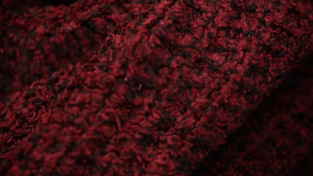 Red warm knitted blanket, macro