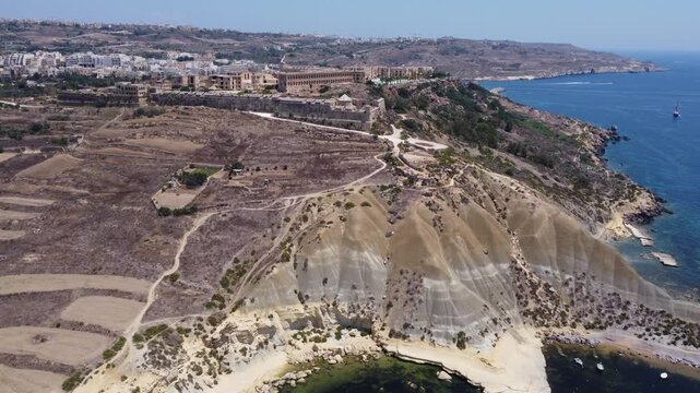 Fort Chambray, Gozo, Malta, aerial view. Approaching from the Xatt L-Ahmar salt pans. High quality 4k footage