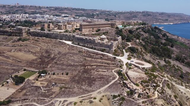 Fort Chambray, Gozo, Malta, aerial view. Approaching from the Xatt L-Ahmar salt pans. High quality 4k footage