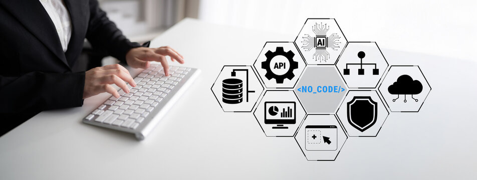 Business Professional Working on Keyboard with No-Code Icons Representing Modern Technology and Innovation in Digital Transformation Quark.