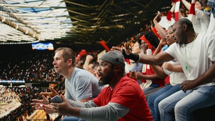 Excited diverse supporters jumping after winning live bet result, stadium crowd with adrenaline enjoying team victory, Happy fans celebrate successful sports betting with raised fists, lucky win. © DC Studio