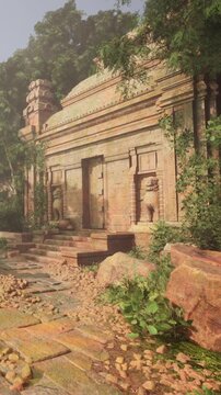 An old temple with stone walls and statues, surrounded by trees and plants. A stone pathway leads to the entrance, which is partially covered by greenery.