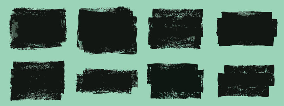 Set of eight black textured paint stroke squares and rectangles on a light green background