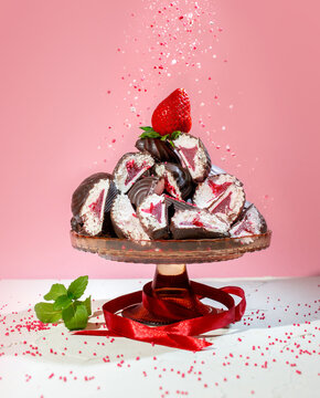 Chocolate Covered Marshmallows with Strawberry Filling and Fresh Strawberries on Pink Background
