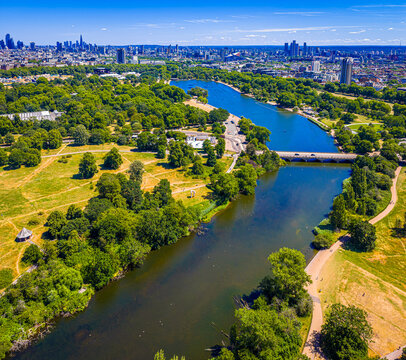 Hyde Park Serpentine aerial view with London skyline in summer sunlight