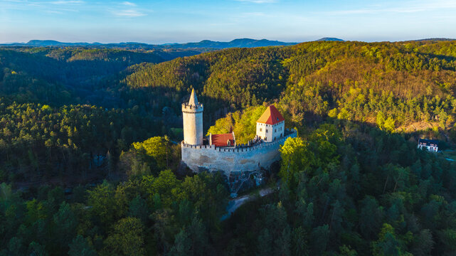 Aerial view of Kokorin Castle nestled within a lush forest landscape in Kokorin, Central Bohemian Region, Czechia.