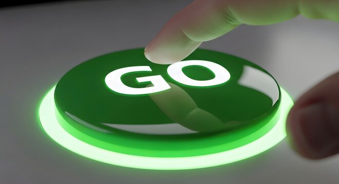 Finger pressing a glowing green go button