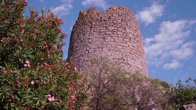 Low Angle View of Historic Assos Castle Walls Against Blue Sky