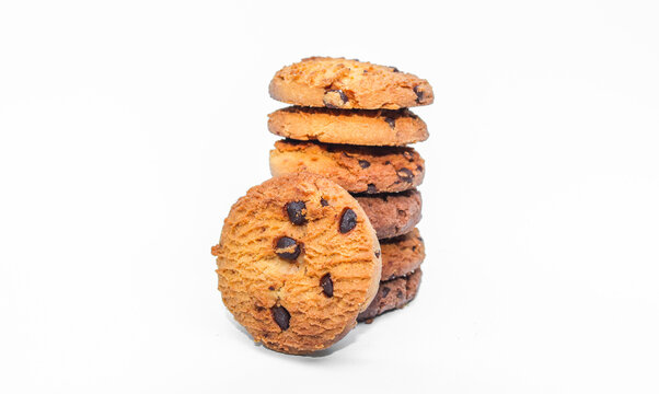 A stack of chocolate chip cookies isolated on a white background. Cookies with chocolate chips stack high.