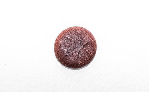 Delicious Chocolate filled cookies isolated on white background. Brown round biscuit with sweet chocolate filling. Stack of cookies