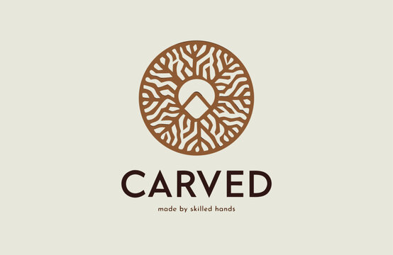 Wood carving circular logo design with intricate organic grain texture featuring a mountain peak for woodworking