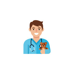 Fototapeta premium Friendly male pediatrician holding a teddy bear wearing scrubs