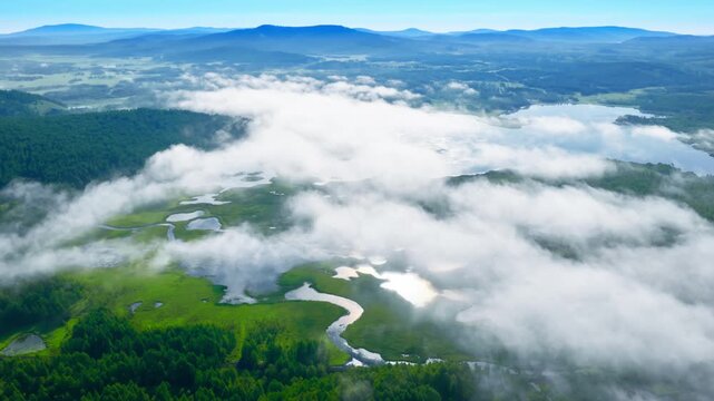 Aerial View of Winding River Through Cloud - Covered Wetlands