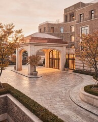 Fototapeta premium Modern brick hotel entrance courtyard with arched porte cochere