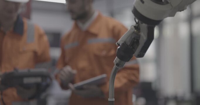 automation machine engineer student study and inspection control robot arm machine in university or factory workshop. AI robot technology are new innovation trend for manufacturing in industry