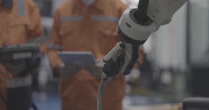 automation machine engineer student study and inspection control robot arm machine in university or factory workshop. AI robot technology are new innovation trend for manufacturing in industry
