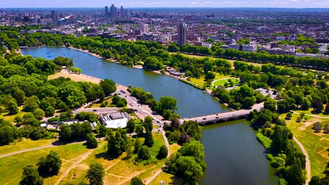Aerial view of Hyde Park and Serpentine lake in London on a clear summer day; ideal for travel promotion, real estate, tourism, and urban lifestyle design