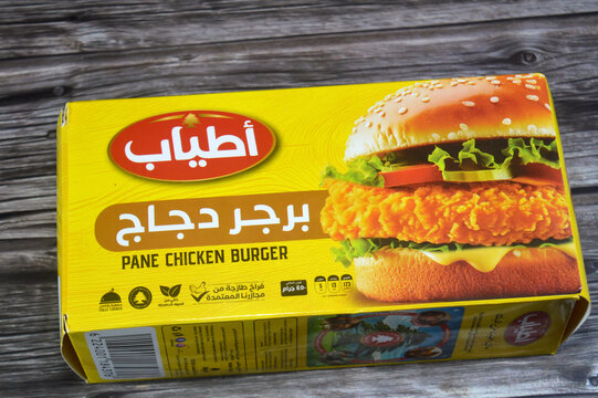 Cairo, Egypt, June 16 2026: a box of Atyab Frozen Breaded Chicken Burgers, contains pre-formed, breaded frozen chicken patties meant to be cooked directly from the freezer without thawing