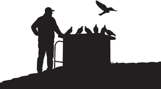 Silhouette of man feeding pigeons from trash can
