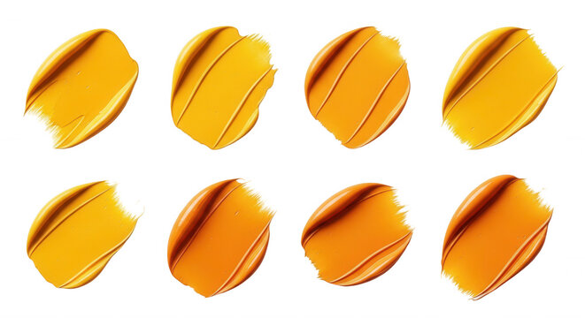 close-up of eight yellow and orange paint strokes on a white background useful for design cosmetics and artistic purposes