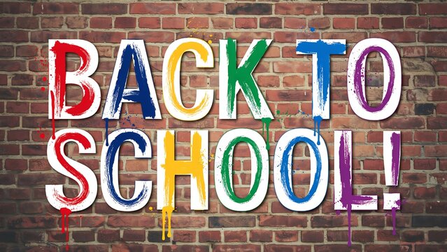 Colorful back to school text on a brick wall background