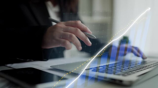 A focused business professional analyzes data trends on a laptop in a modern workspace, highlighting key metrics for informed decision-making and growth strategies. Copula