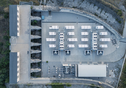 Ventavon, France - 28 June 2026: Aerial view of the Battery Energy Storage System with rows of white storage containers, cooling units, and technical infrastructure.