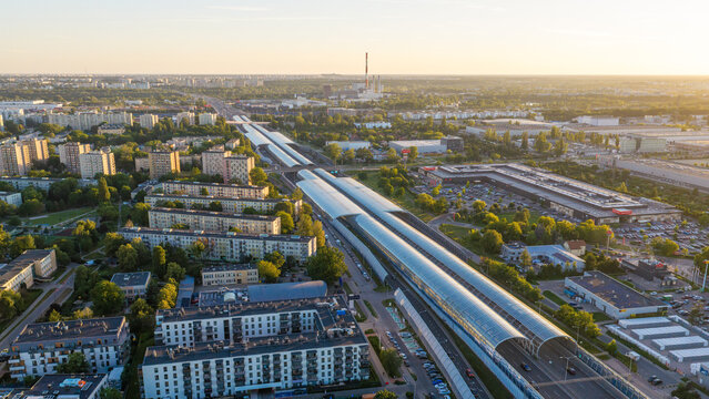 Warszawa, Poland - 24 June 2026: Aerial view of the Torunska route and urban landscape, featuring modern infrastructure, residential blocks, and green spaces under golden hour light.