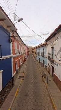 Empty cobblestone street and traditional colorful facade in Potosi Bolivia Calle Tarija