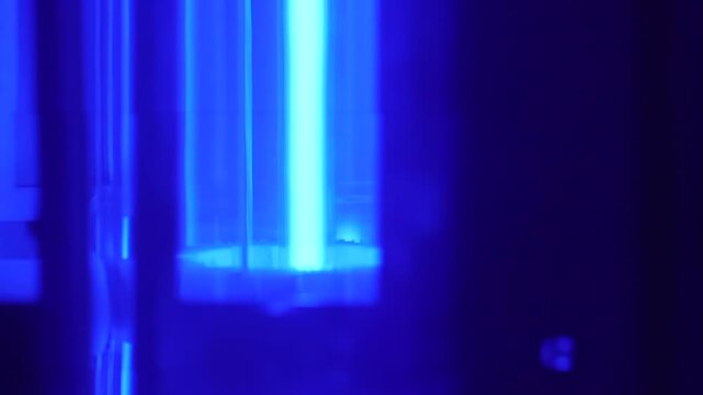 Interior view of a xenon test chamber with rotating sample panels around a xenon lamp during accelerated aging and material durability testing.