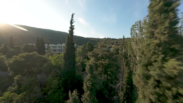 Sanatorio Abandoned Hospital in Kavala Greece, Fpv Drone Immersive Flight, Building Reveal Behind Trees and City Nature