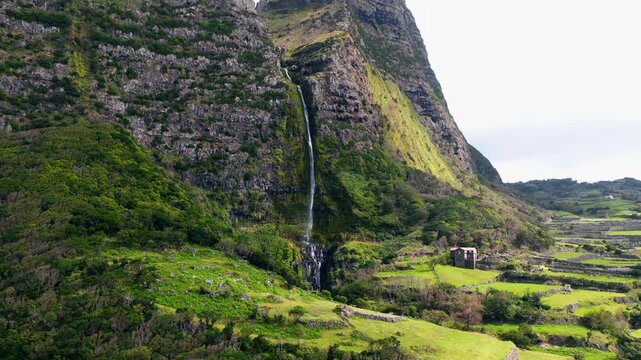 Cascata do Poco do Bacalhau - Codfish Well Waterfall In Faja Grande, Flores Island In Azores, Portugal. - aerial shot