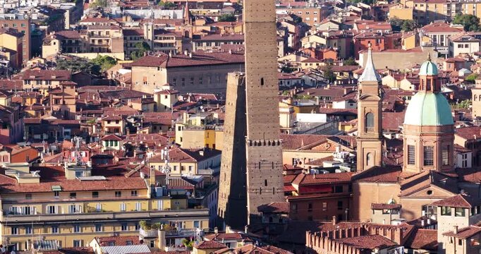 Two Towers, Garisenda And Asinelli, Rising Above The Historic City Center Of Bologna In Emilia-Romagna, Italy. Aerial Shot