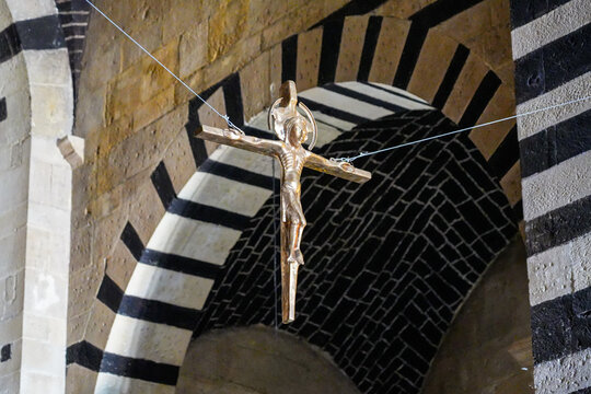 Crucifix suspended before the apse in the San Pietro di Sorres Benedictine Monastery in Borutta, Sardinia, Italy