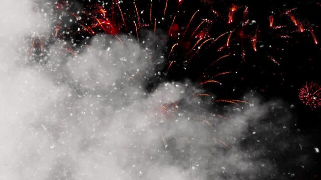 Fireworks exploding in night sky with smoke